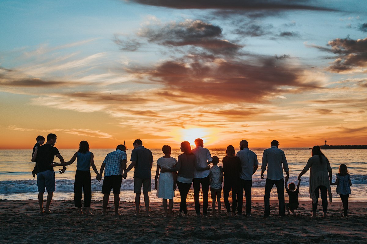 Family standing together outside their home