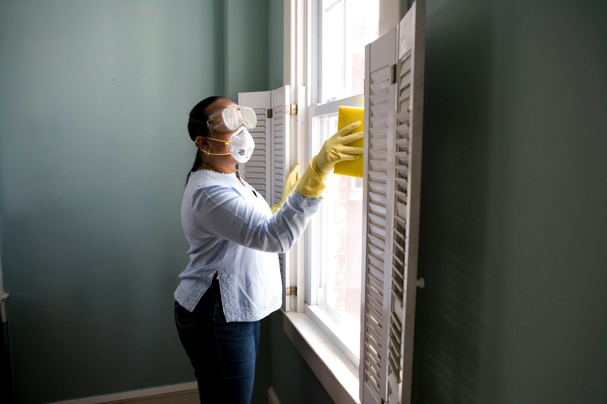 Home professional reviewing a covered appliance